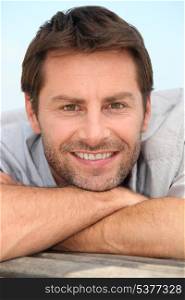 smiling man with stubble