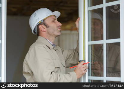smiling man working with window