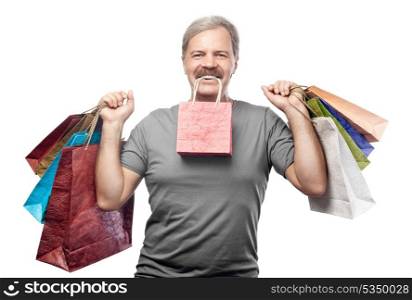 smiling mature man holding shopping bags isolated on white background