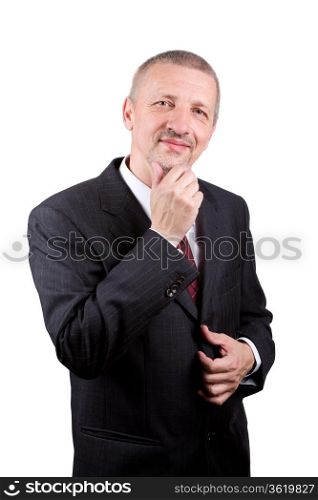 Smiling mature man in business suit thinking and scratching his chin