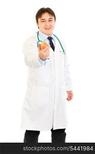 Smiling medical doctor holding apple isolated on white&#xA;