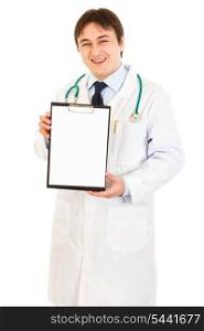 Smiling medical doctor holding blank clipboard isolated on white&#xA;