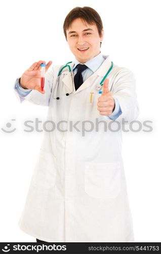 Smiling medical doctor holding blood sample and showing thumbs up gesture isolated on white&#xA;