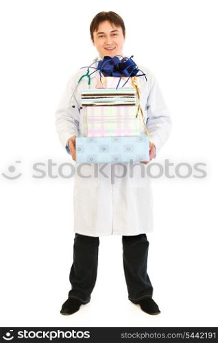 Smiling medical doctor holding presents in hands isolated on white&#xA;