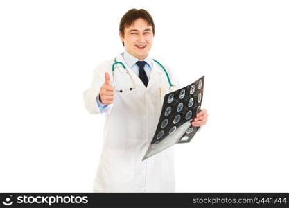Smiling medical doctor holding tomography and showing thumbs up gesture isolated on white&#xA;