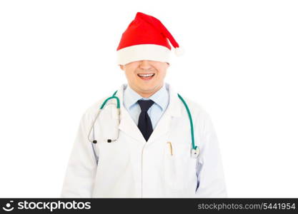 Smiling medical doctor in Christmas hat stretched over his eyes isolated on white&#xA;