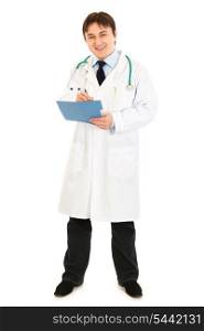 Smiling medical doctor making notes in medical chart isolated on white&#xA;
