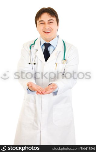 Smiling medical doctor presenting something on empty hands isolated on white&#xA;