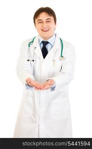 Smiling medical doctor presenting something on empty hands isolated on white&#xA;