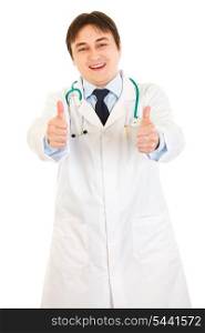 Smiling medical doctor showing thumbs up gesture isolated on white&#xA;