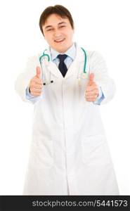 Smiling medical doctor showing thumbs up gesture isolated on white&#xA;