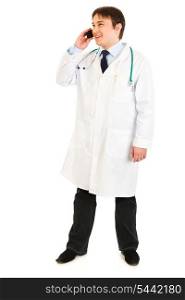 Smiling medical doctor talking on mobile phone isolated on white&#xA;