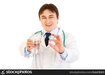 Smiling medical doctor with tablet and glass of water in hands isolated on white&#xA;