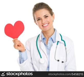 Smiling medical doctor woman holding paper heart