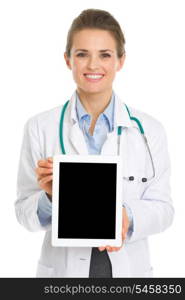 Smiling medical doctor woman showing tablet pc