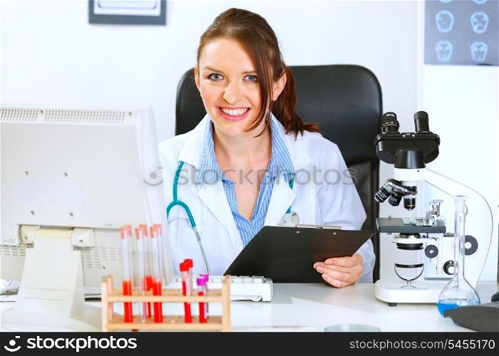 Smiling medical doctor woman working in office&#xA;