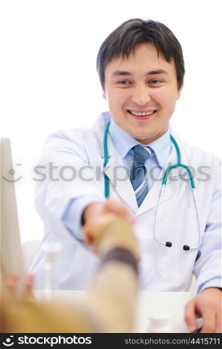 Smiling medical shaking patients hand