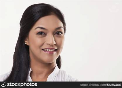 Smiling mid adult woman over white background