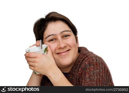 Smiling mid age woman holding a cup isolated