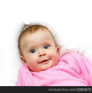 smiling newborn baby girl on pillow close-up