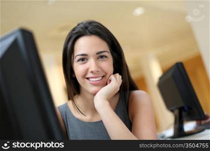Smiling office worker at ther desk
