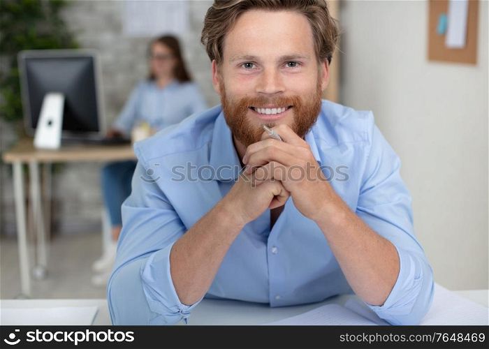 smiling office worker looking at the camera