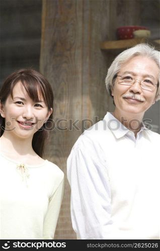 Smiling old asian man and girl