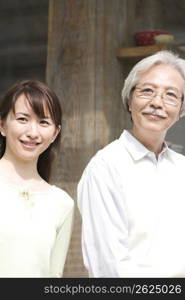 Smiling old asian man and girl