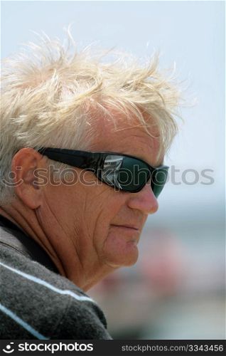 smiling older man with sun glasses