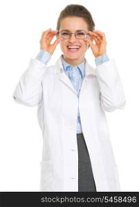 Smiling ophthalmologist doctor straitening glasses