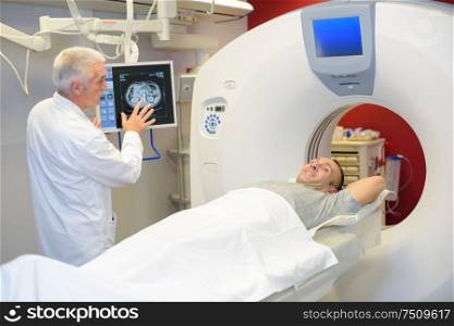 Smiling patient having brain scan