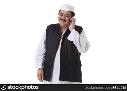 Smiling politician talking on cell phone