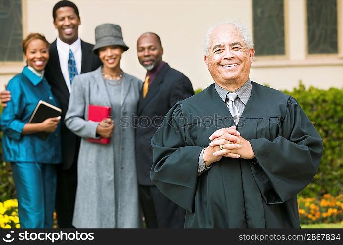 Smiling Preacher with Congregation