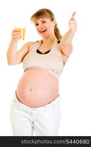 Smiling pregnant woman holding glass of juice and showing thumbs up gesture isolated on white&#xA;