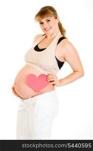 Smiling pregnant woman holding heart near her belly isolated on white&#xA;