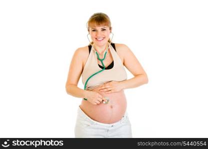 Smiling pregnant woman holding stethoscope on her tummy isolated on white&#xA;