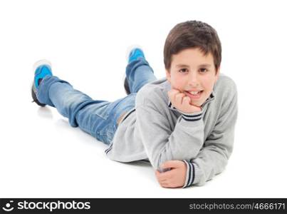 Smiling preteen boy lying on the floor isolated on a white background
