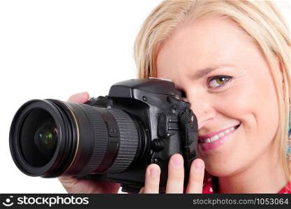 smiling pretty blonde woman photographer with camera, on white
