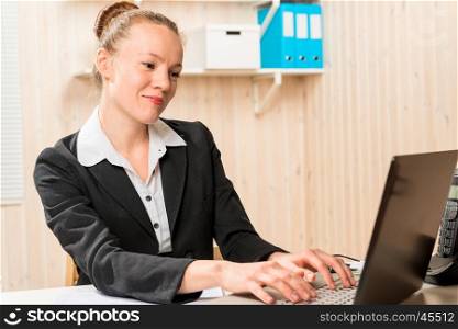 smiling pretty secretary typing text on your computer
