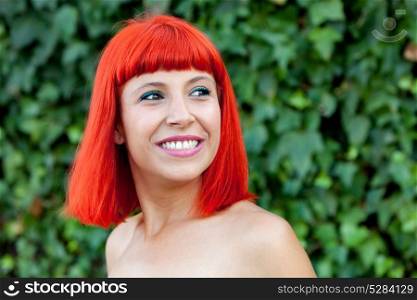 Smiling red head girl during a day in the park