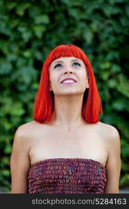 Smiling red head girl during a day in the park