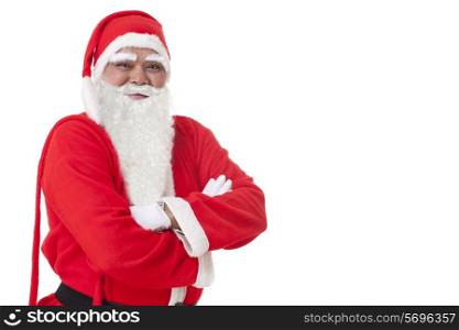 Smiling Santa Claus with arms folded over white background
