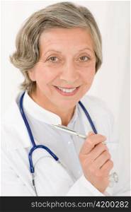 Smiling senior doctor female with stethoscope professional portrait