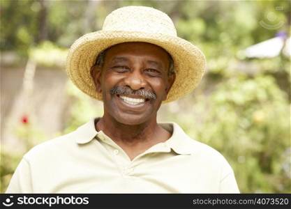 Smiling Senior Man In Garden