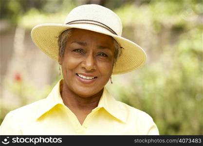 Smiling Senior Woman In Garden