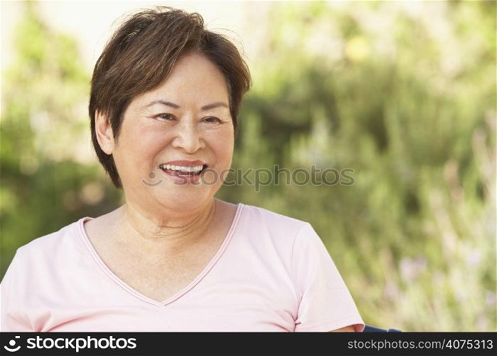 Smiling Senior Woman In Garden