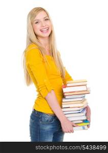 Smiling student girl holding stack of books