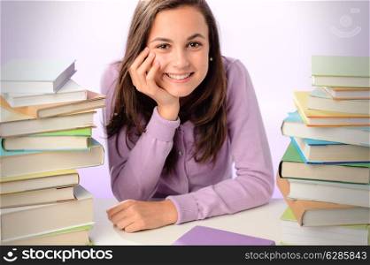 Smiling student girl sitting between stacks of books purple background