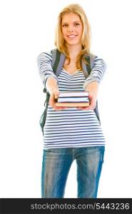 Smiling teen girl with schoolbag giving books isolated on white &#xA;
