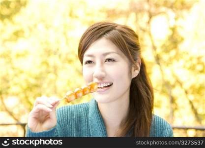 Smiling teenage girl eating